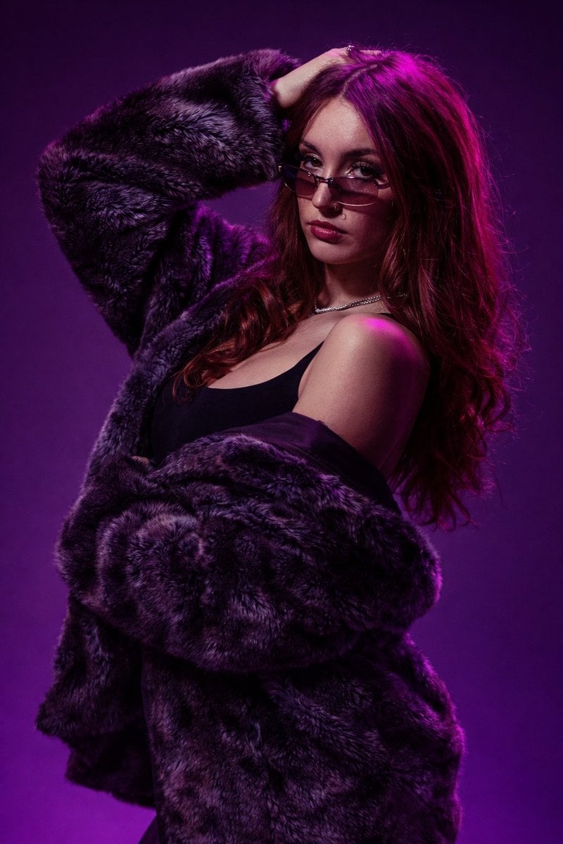 Confident Young Woman Studio Fashion Portrait with Rectangular Sunglasses