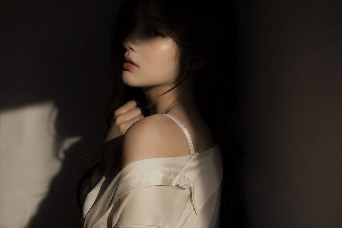 Mysterious Korean Female Idol in Dramatic Shadow Editorial Portrait